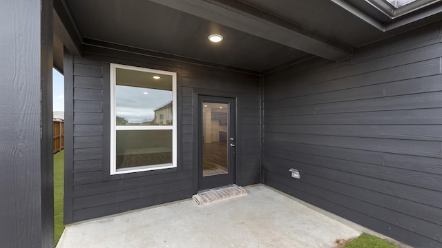 entrance to property with a patio area