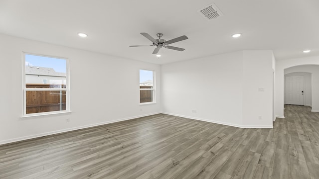 unfurnished room featuring ceiling fan and light hardwood / wood-style floors