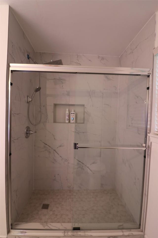 bathroom with an enclosed shower