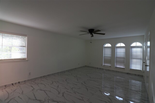 unfurnished room featuring ceiling fan