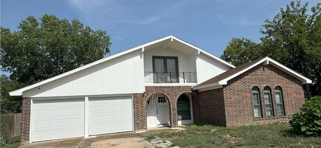 view of front of house with a balcony and a garage