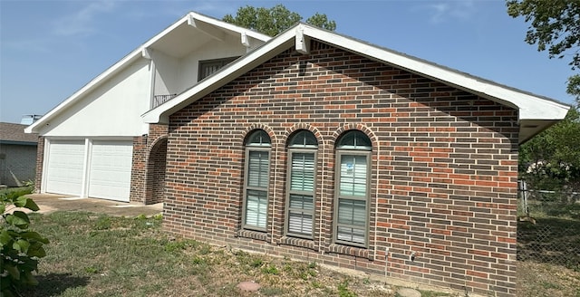 view of property exterior with a garage