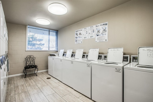 laundry room with washing machine and clothes dryer