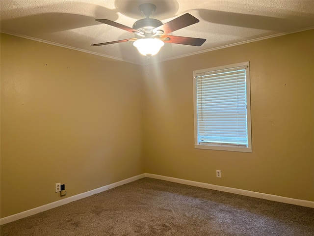 carpeted spare room featuring crown molding, ceiling fan, and a textured ceiling