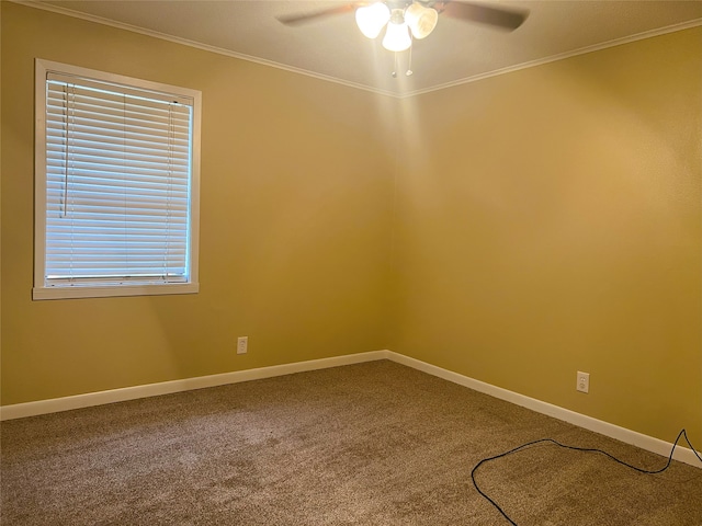 spare room featuring crown molding, carpet, and ceiling fan