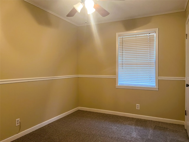 carpeted empty room featuring crown molding and ceiling fan