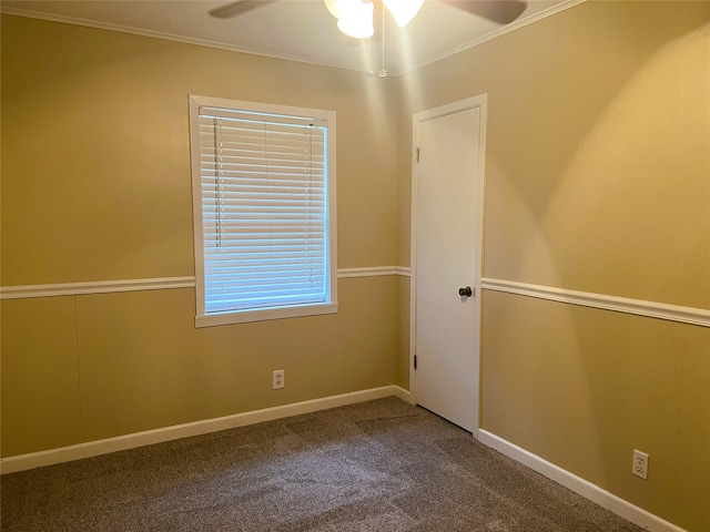 spare room with crown molding, carpet, and ceiling fan