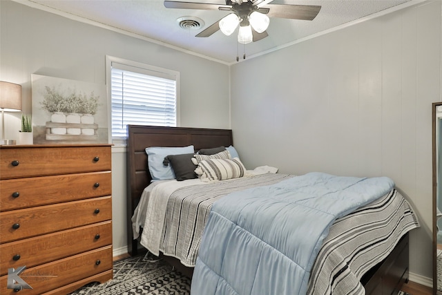 bedroom featuring ceiling fan and ornamental molding