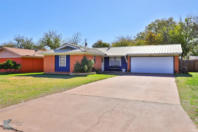 single story home with a front yard and a garage