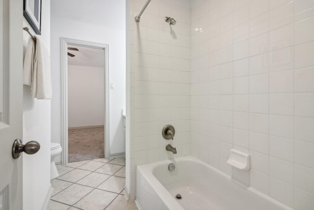 full bath featuring shower / bath combination, baseboards, toilet, and tile patterned floors