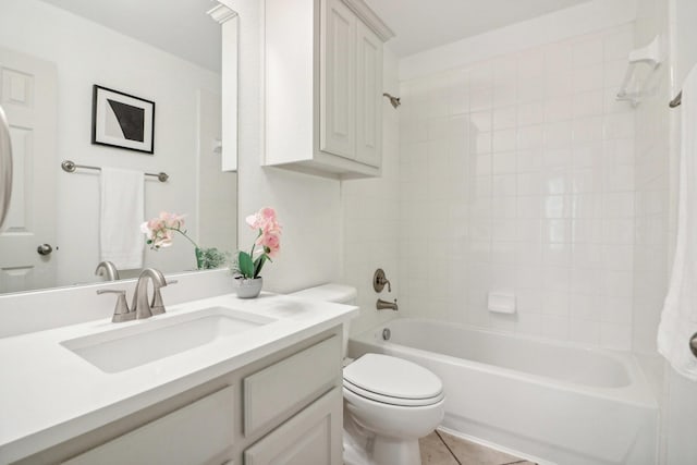 full bath featuring  shower combination, vanity, toilet, and tile patterned floors