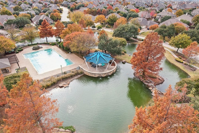 bird's eye view featuring a water view and a residential view