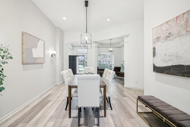 dining space with recessed lighting, light wood-type flooring, and baseboards