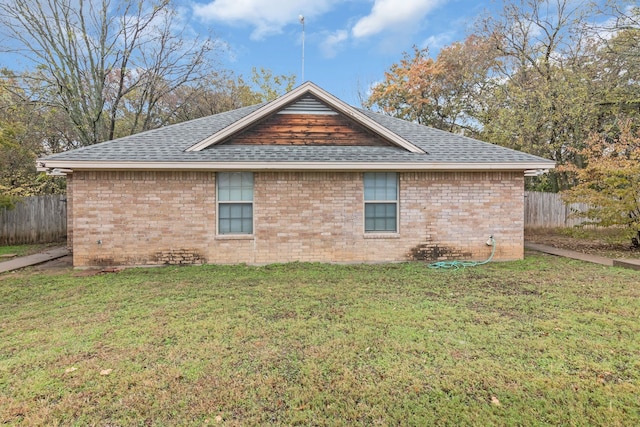 view of home's exterior with a yard