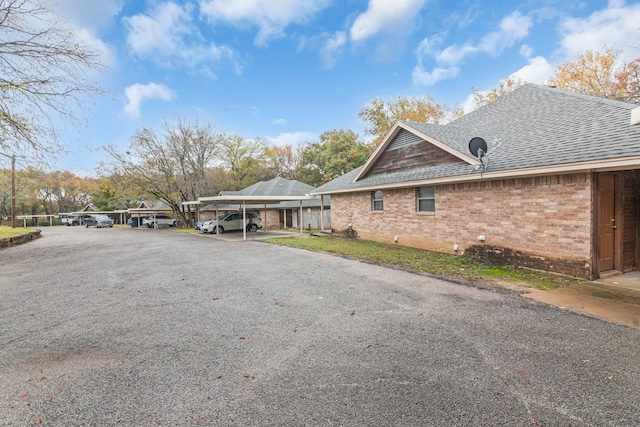 view of property exterior with a carport