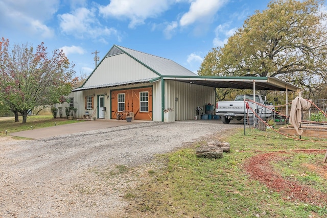 view of side of property featuring a carport