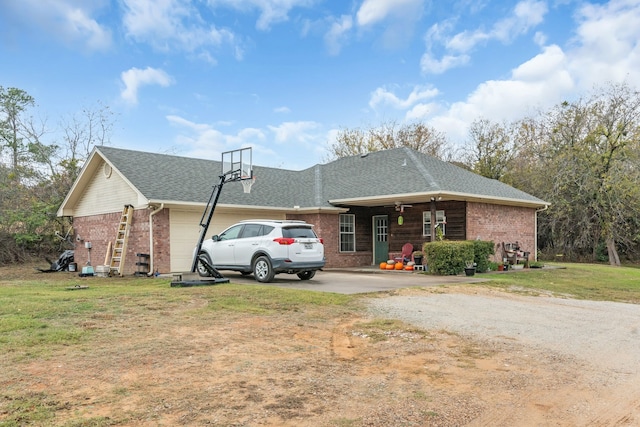 single story home featuring a front yard and a garage