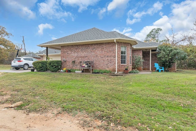 view of home's exterior with a yard