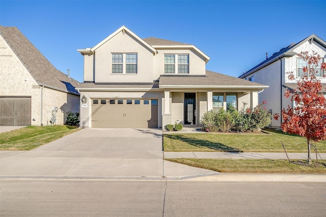 view of front of home with a front yard and a garage