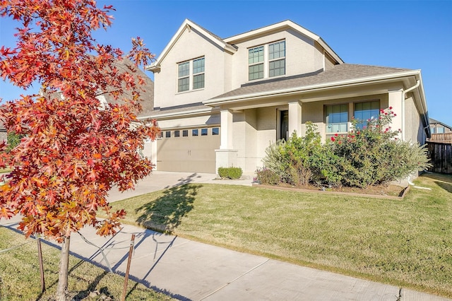 view of front of home featuring a garage and a front lawn