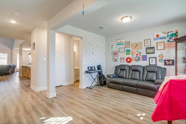 living room with light hardwood / wood-style flooring