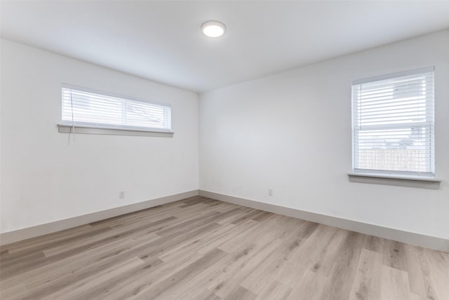 spare room featuring light hardwood / wood-style flooring