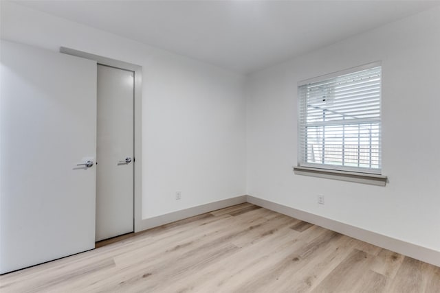 unfurnished room featuring light hardwood / wood-style floors