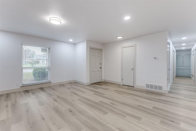 spare room with light wood-type flooring