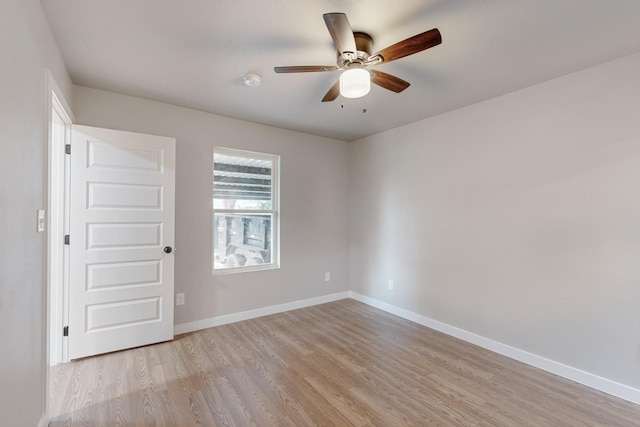 spare room featuring ceiling fan and light hardwood / wood-style flooring