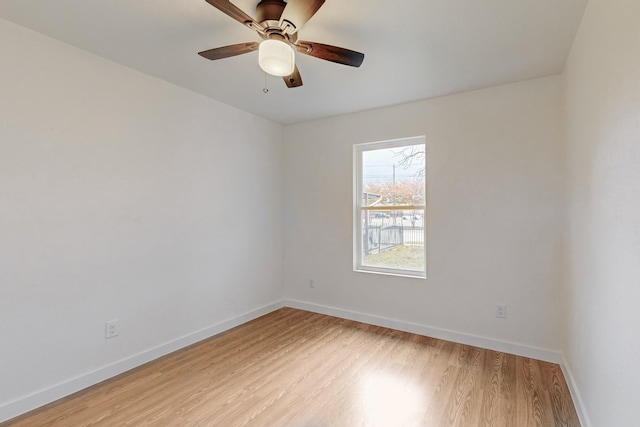 empty room featuring ceiling fan and light wood-type flooring