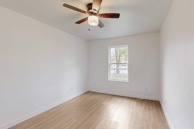 spare room featuring light wood-type flooring and ceiling fan