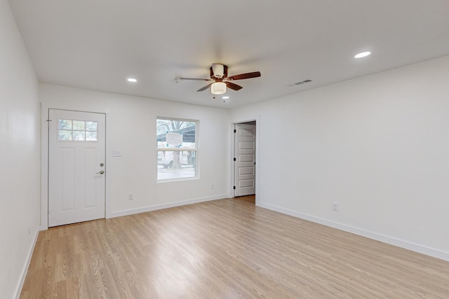 foyer featuring ceiling fan and light hardwood / wood-style floors