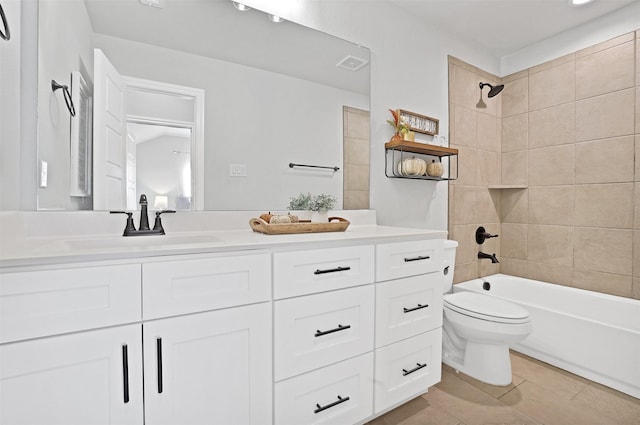 full bathroom with vanity, tiled shower / bath combo, and toilet