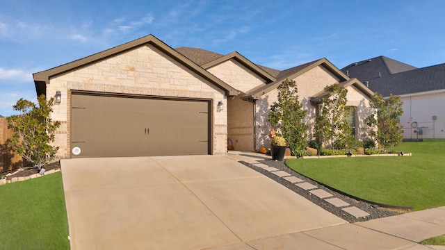 view of front of house featuring a garage and a front lawn