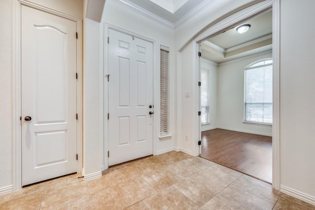 entrance foyer featuring light hardwood / wood-style floors and ornamental molding