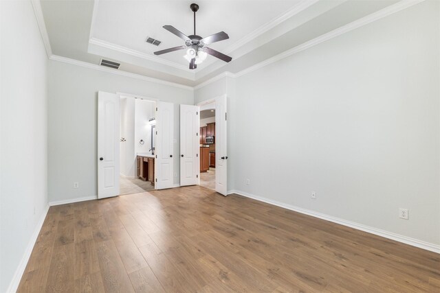 bathroom featuring walk in shower, wood-type flooring, vanity, and ceiling fan