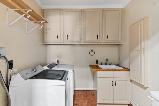 laundry room featuring separate washer and dryer, sink, cabinets, and ornamental molding