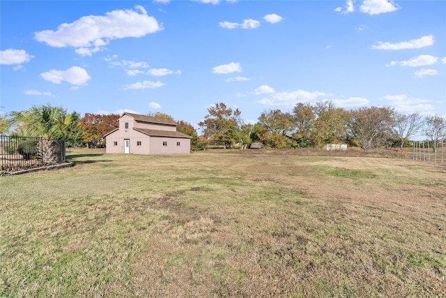 view of yard with a rural view