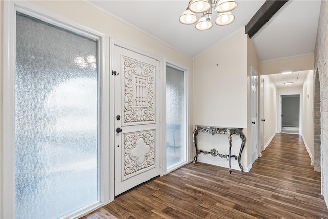 entryway featuring a notable chandelier, vaulted ceiling with beams, and dark hardwood / wood-style flooring