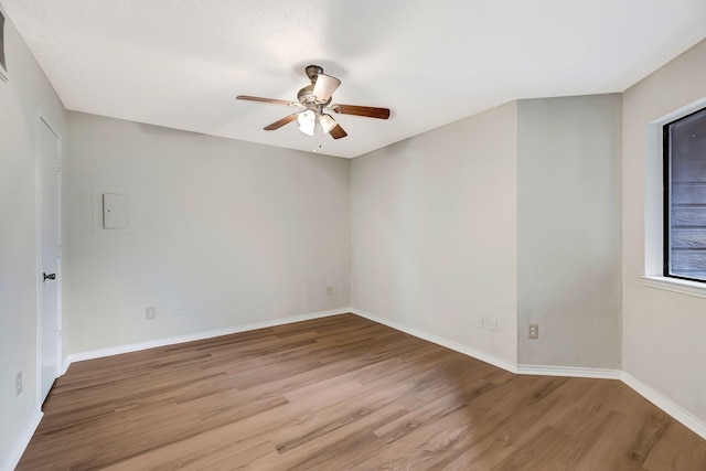 unfurnished room with light hardwood / wood-style floors and ceiling fan