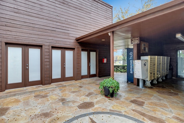 view of patio / terrace with mail boxes and french doors