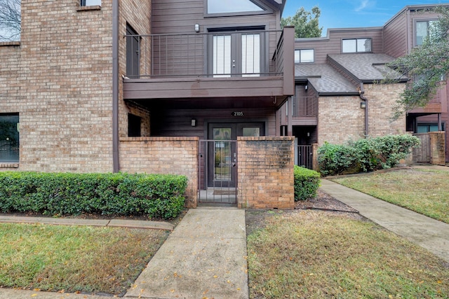 view of exterior entry featuring french doors