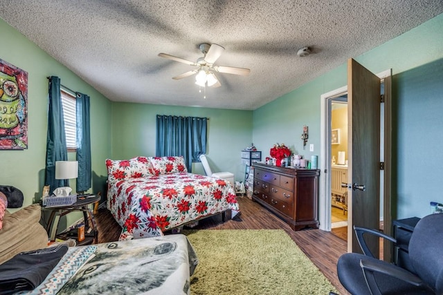 bedroom featuring a textured ceiling, ceiling fan, and dark wood-type flooring