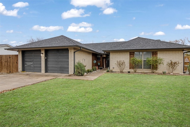 ranch-style home with a garage and a front yard