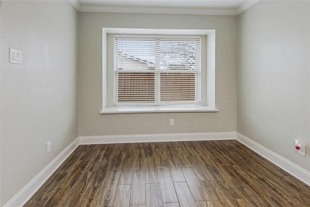 spare room with crown molding and dark wood-type flooring