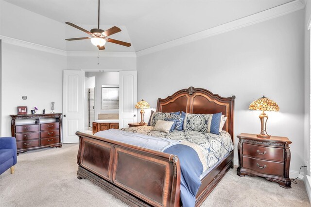 carpeted bedroom featuring connected bathroom, crown molding, ceiling fan, and lofted ceiling