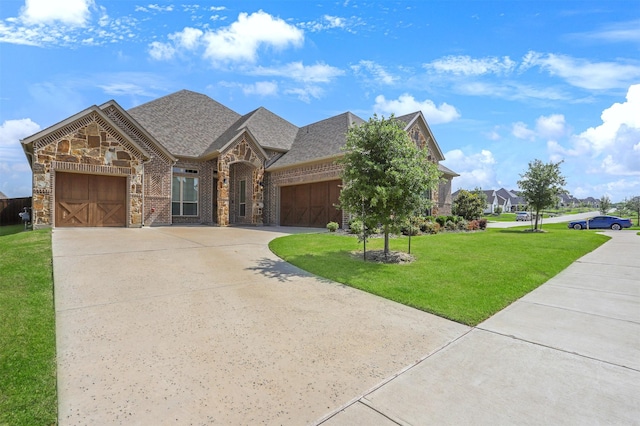 view of front facade featuring a garage and a front lawn