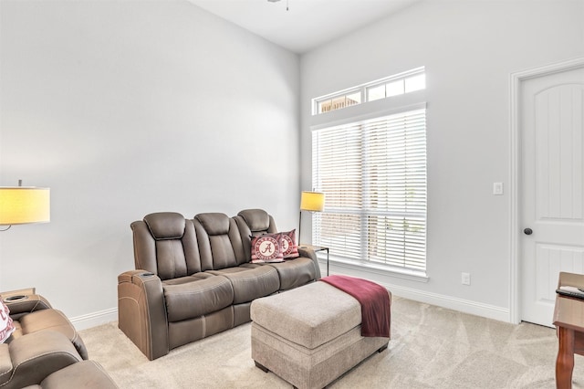 carpeted living room featuring plenty of natural light