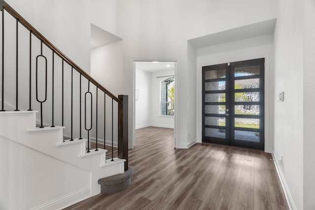 entrance foyer featuring french doors and hardwood / wood-style flooring