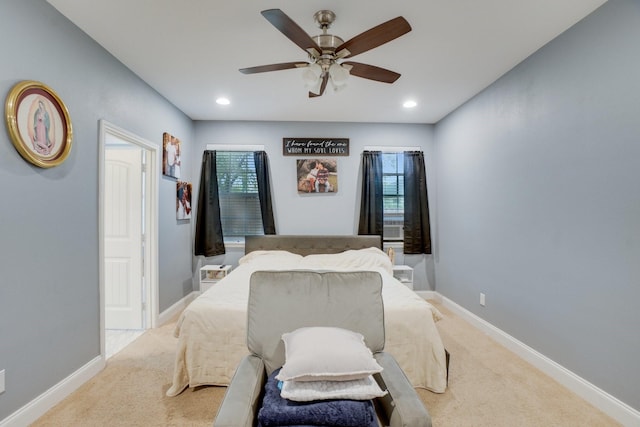 carpeted bedroom with ceiling fan